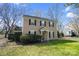 View of home featuring a traditional design with a well-maintained lawn and tidy landscaping at 8501 Golf Ridge Dr, Charlotte, NC 28277