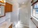Clean and well-lit bathroom with shower, vanity, and ample storage space at 898 Sage Field Ln, Lincolnton, NC 28092