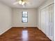 Clean and simple bedroom, with a ceiling fan, good natural light, and double-door closet at 898 Sage Field Ln, Lincolnton, NC 28092
