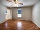 A cozy bedroom with a window offering natural light and door to a possible on suite at 898 Sage Field Ln, Lincolnton, NC 28092
