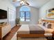 Serene bedroom with vaulted ceiling, large window, and hardwood floors, perfect for relaxation at 898 Sage Field Ln, Lincolnton, NC 28092
