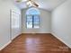 Inviting bedroom with arched window, closet, hardwood floors, and ample natural light at 898 Sage Field Ln, Lincolnton, NC 28092