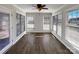 Enclosed sunroom with vinyl floors and an abundance of windows offering ample natural light at 898 Sage Field Ln, Lincolnton, NC 28092