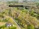 Aerial view of a property with 2.45 acres surrounded by mature trees at 9136 Ladson Rd, Indian Land, SC 29707
