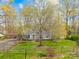 Charming home with a spacious front yard and mature trees, surrounded by a wooden fence at 9136 Ladson Rd, Indian Land, SC 29707