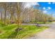 Great lawn, long driveway leading to the house, shed, and mature trees at 9136 Ladson Rd, Indian Land, SC 29707