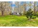 Lush lawn leads to home with mature trees and charming split-rail fence at 9136 Ladson Rd, Indian Land, SC 29707