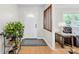 Welcoming foyer with hardwood floors, coat rack, and lots of natural light at 9136 Ladson Rd, Indian Land, SC 29707