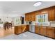 Charming kitchen featuring natural wood cabinets and stainless appliances with breakfast area for Gathering meals and entertaining at 9136 Ladson Rd, Indian Land, SC 29707