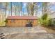 Charming outbuilding with double doors and windows, surrounded by mature landscaping at 9136 Ladson Rd, Indian Land, SC 29707