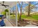 Inviting covered porch with rocking chair and view of lush yard and mature trees at 9136 Ladson Rd, Indian Land, SC 29707