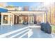 Spacious backyard patio with comfortable seating, ceiling fans, and stylish outdoor furniture at 10032 Hunters Trace Dr, Concord, NC 28027