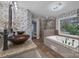 This primary bathroom features dual sinks, a soaking tub, and a tiled shower at 10032 Hunters Trace Dr, Concord, NC 28027