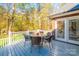 An inviting outdoor space with seating for six offers a tranquil retreat among colorful autumn trees at 10032 Hunters Trace Dr, Concord, NC 28027