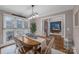 This dining room features a decorative light fixture and an office view at 10032 Hunters Trace Dr, Concord, NC 28027