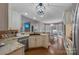 Open-concept kitchen with a breakfast nook, granite countertops, and stainless steel appliances at 10032 Hunters Trace Dr, Concord, NC 28027