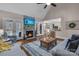 This living room features hardwood floors, vaulted ceilings, and a stone fireplace at 10032 Hunters Trace Dr, Concord, NC 28027