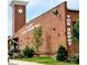 Exterior view of the Depot Antique & Designer Mall featuring a historic brick building and clock tower at 10032 Hunters Trace Dr, Concord, NC 28027