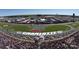 Aerial view of Charlotte Motor Speedway during a race, showcasing the track and grandstands filled with fans at 10032 Hunters Trace Dr, Concord, NC 28027