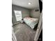 Well-lit bedroom with soft green walls, comfortable bed, and carpeted floor at 102 Guffey Rd, Cherryville, NC 28021