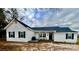 Charming single-story home with white siding, black shutters, covered front porch and well-kept lawn at 102 Guffey Rd, Cherryville, NC 28021