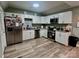 Modern kitchen featuring stainless steel appliances, granite countertops, and ample cabinet space at 102 Guffey Rd, Cherryville, NC 28021
