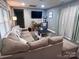 Comfortable living area with soft gray walls, large sectional sofa, and contemporary furnishings at 102 Guffey Rd, Cherryville, NC 28021