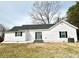 Home's rear exterior features a sliding glass door and a well-maintained lawn at 102 Guffey Rd, Cherryville, NC 28021