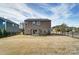 Large, fenced backyard featuring a patio with pergola and a well-maintained lawn at 11203 Chapeclane Rd, Charlotte, NC 28278