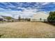 Expansive backyard with a black fence and lush grass, offering ample space for outdoor activities at 11203 Chapeclane Rd, Charlotte, NC 28278