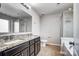 Bathroom with granite countertops, dual sinks, toilet, and a shower and bathtub at 11203 Chapeclane Rd, Charlotte, NC 28278