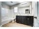 Bathroom featuring a dual sink vanity, large mirror, and tub/shower combo at 11203 Chapeclane Rd, Charlotte, NC 28278