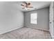 A bedroom featuring a neutral color scheme with carpet and a ceiling fan and a window at 11203 Chapeclane Rd, Charlotte, NC 28278