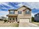Charming two-story home showcasing a neutral color palette, well-maintained landscaping, and a two-car garage at 11203 Chapeclane Rd, Charlotte, NC 28278