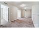 Carpeted hallway with neutral walls and overhead lighting at 11203 Chapeclane Rd, Charlotte, NC 28278