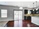 This kitchen has stainless steel appliances, an island, and access to the backyard at 11203 Chapeclane Rd, Charlotte, NC 28278