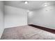 The room features neutral carpeting and a transition to hardwood flooring at 11203 Chapeclane Rd, Charlotte, NC 28278
