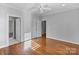 Bedroom with hardwood floors, neutral paint, and lots of natural light at 1131 S Kings Dr, Charlotte, NC 28207