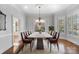 Bright dining room with large window and chandelier over the table at 1131 S Kings Dr, Charlotte, NC 28207