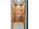 A wooden elevator with a patterned carpet at 1131 S Kings Dr, Charlotte, NC 28207