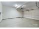 Spacious garage features a clean concrete floor and automatic door opener at 1131 S Kings Dr, Charlotte, NC 28207
