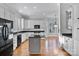 Kitchen with white cabinets, black countertops, and hardwood floors at 1131 S Kings Dr, Charlotte, NC 28207