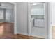 View of laundry room with washer, dryer, storage cabinets, and tile floors at 1131 S Kings Dr, Charlotte, NC 28207