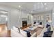 Bright living room features hardwood floors, fireplace, neutral paint, and lots of natural light at 1131 S Kings Dr, Charlotte, NC 28207