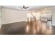 Expansive open-concept living space with hardwood floors, connecting the living room and kitchen at 11679 Red Rust Ln, Charlotte, NC 28277