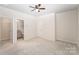 This main bedroom offers neutral colors and a ceiling fan at 11679 Red Rust Ln, Charlotte, NC 28277