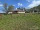 Expansive backyard with lush greenery, mature trees, wooden fence, and a relaxing deck at 117 Jones Rd, Shelby, NC 28150