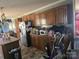 Functional kitchen with wood cabinets, stainless steel refrigerator, and ample counter space at 117 Jones Rd, Shelby, NC 28150