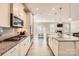 Bright kitchen featuring white cabinets, granite countertops, and stainless steel appliances at 120 Hornbeam Ln, Mooresville, NC 28117