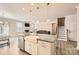 Beautiful kitchen with granite countertops, stainless steel appliances and a farmhouse sink at 120 Hornbeam Ln, Mooresville, NC 28117